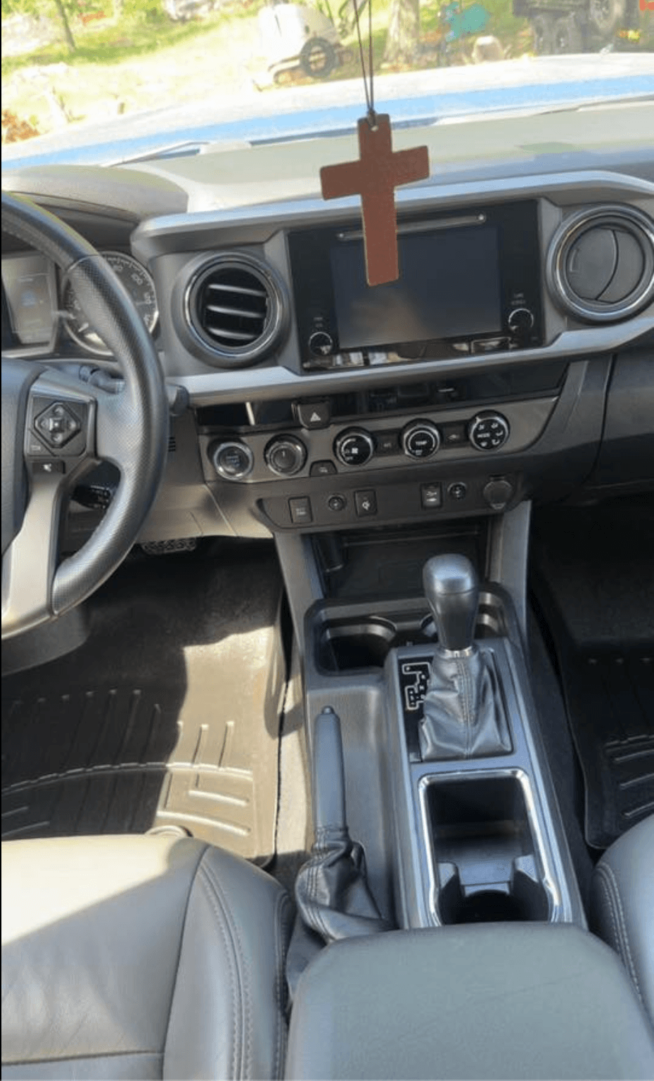 Toyota Tacoma center console, dash, and shifter cleaned after a full interior detail